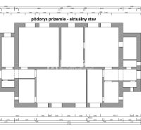 Floor plan of commercial spaces with storage rooms and corridors in the current state.