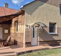 A family house in Krásny Brod with a covered terrace and garden furniture.