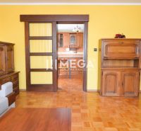 A living room in a family house with wooden furniture and a wooden decor floor.