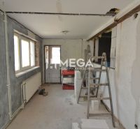 Production facilities with incomplete reconstruction, ladder and blocks, floor with wooden decor.