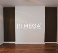 White wall and dark wooden paneling in a family house, floor with wood decor.