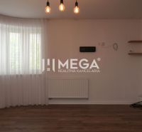 Interior of a family house with a wooden decor floor, curtains, and pendant lights.