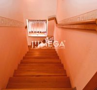 Staircase with a wooden decor floor and a window, Family house.