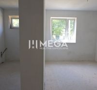 Empty rooms with windows and openings for installations in a family house.