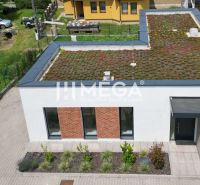 A family house on Gaštanová Street in Humenné with a green roof and a driveway.