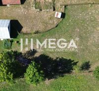 Aerial view of a family house in Kolbasov surrounded by a garden and greenery.