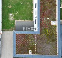 A family house on Gaštanová Street in Humenné with a green roof and an adjacent yard.