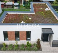 A family house on Gaštanová Street in Humenné with an extensive green roof and a parking space.