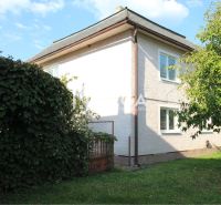 A family house on Staničná Street in Belá nad Cirochou with a landscaped garden and trees.
