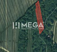 Aerial view of a plot surrounded by fields and forests in Jasenov on Jasenov Street.