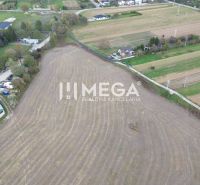 Field in Jasena on Jasena Street with peculiar properties and nearby buildings.