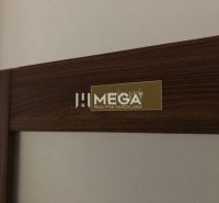 Interior of the building with a detail on the real estate agency's sign and verification certificate.