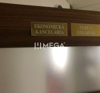 Wooden decor on the door with nameplates Economic Office and Chief Pharmacist.
