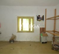 Commercial space with a simple sink, shelves, and a window, without flooring with a wooden decor.