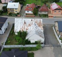A view of buildings on Mieru Street in Stakčín surrounded by greenery, suitable for commercial spaces.