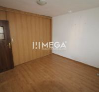 A room in a 3-room apartment with a wooden decor floor and a built-in wardrobe.