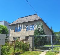A family house on Jesenského Street in Snina, with a garden and fencing.