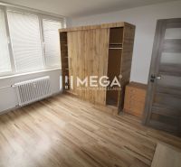 Interior of a 3-room apartment with wooden decor and a large wardrobe.