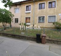 An older 5 or more room apartment on Gagarinova Street in Snina with a small front garden.