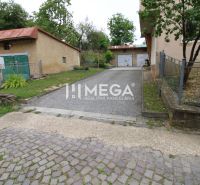 Exterior of a 5 or more room apartment on Gagarinova Street in Snina, with a garage and driveway.