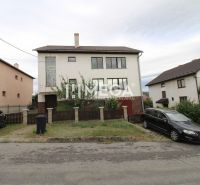 A family house in Snina on Snina Street with a garden and parking in front of the house.
