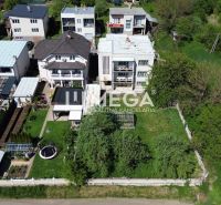 Family houses on Gagarin Street in Snina with gardens and lawns.