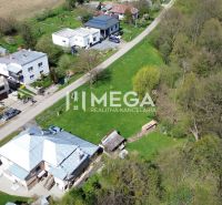Aerial view of houses on a quiet street with residential plots in Staré.