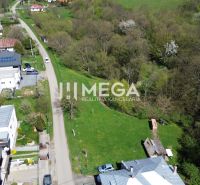 Plots - housing on Old Roads in Staré, surrounded by greenery and houses.