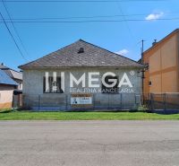 A family house in Kochanovce on Kochanovce Street with fencing and a garden.