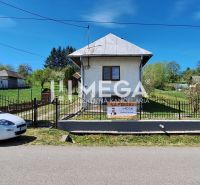 A family house in Zbudská Belá in Zbudská Belá with a white car in front of the gate.