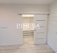 Interior of a family house with white sliding doors and a wooden decor floor.