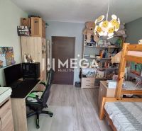 Children's room with a bunk bed, a desk, and shelves in a 3-room apartment.