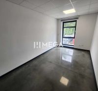Offices with a large window and concrete floor, space on Strojnícka Street in Prešov.