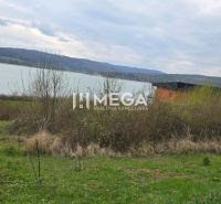 Holčíkovce: Residential plots by the water with a view of the hilly landscape.