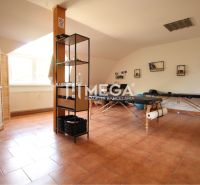 Commercial spaces with folding beds and shelves, floor with brick decor.