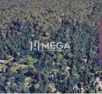Aerial view of residential plots on Šípková Street, Košice IV, surrounded by forest.