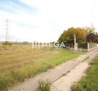 Land in Mokranie suitable for plots - residential, with power poles and a road.