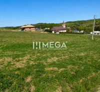 Plots - housing in Víťazovce with a church in the background, an ideal location for construction.