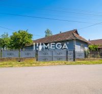 A family house in Veľká Ida with a large gate and garden on a quiet street.