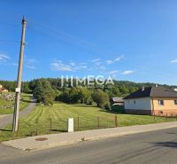 Lands - housing in the village of Slovenská Volová, grassy meadow near the church in a peaceful environment.