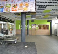Interior of commercial premises with a dining area, menu on the wall.