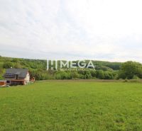 A house on a residential plot in Vyšný Kazimír, surrounded by nature and greenery.