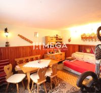 Wooden furnishings and rustic furniture in the interior of a cabin with wooden decor.