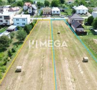 Plots - housing in Jasenov surrounded by houses and green trees.