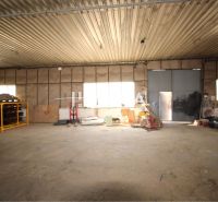 Warehouses and halls with open space and stored materials.