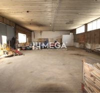 Warehouses and halls with tools and vehicles, concrete floor.