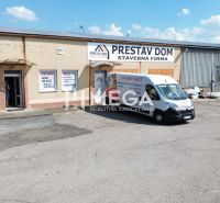 Offices on Fidlikova Street in Humenné with a parking lot and a company van.