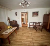 Living room in a family house with a wooden decor floor and furniture.