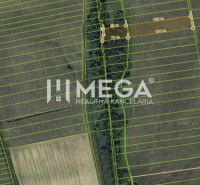 Aerial view of agricultural and forest lands in Humenné, showing parcel lines and surroundings.