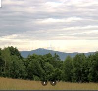 Forests and fields in Maškovce with a view of the hills and the sky.